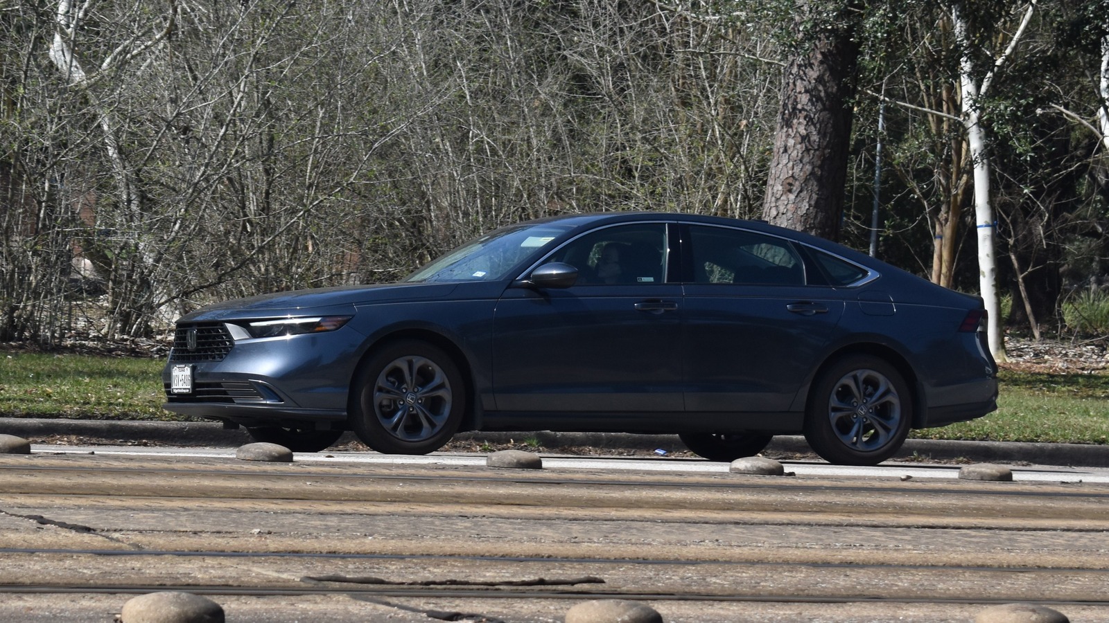 2025 Honda Accord Hybrid sedan driving on a road