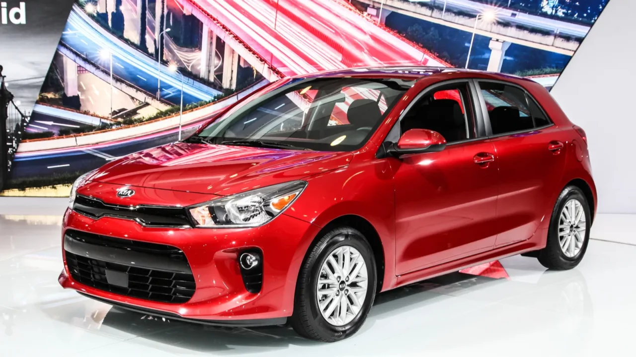 Shot of red Kia Rio displayed at a show.