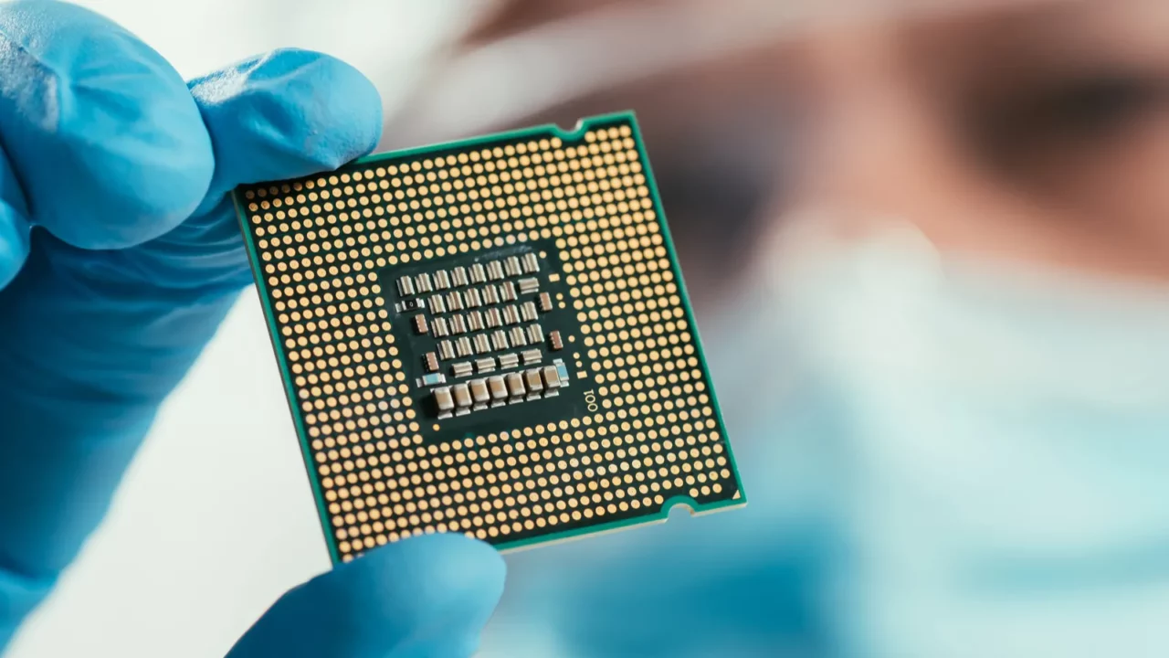 Selective Focus of an engineer holding a computer microchip.