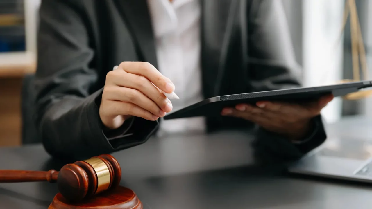 Cropped view of female in a courtroom.