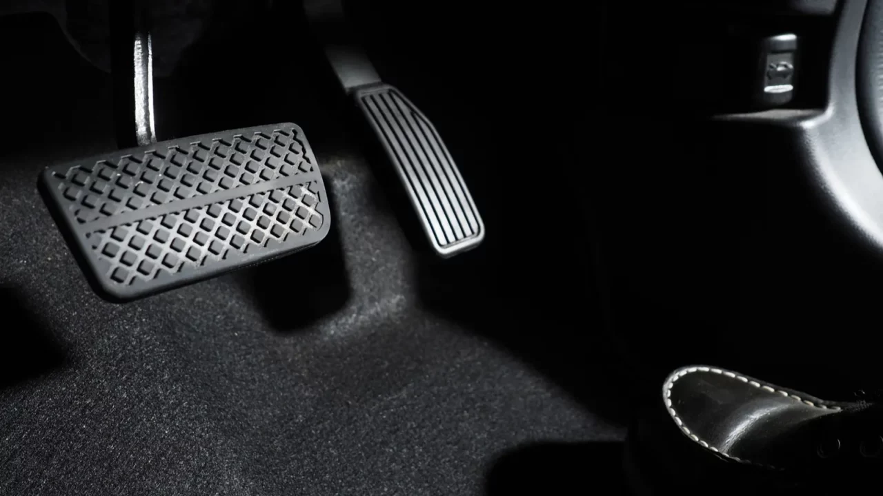 Accelerate and brake the foot pressing the foot pedal of a car