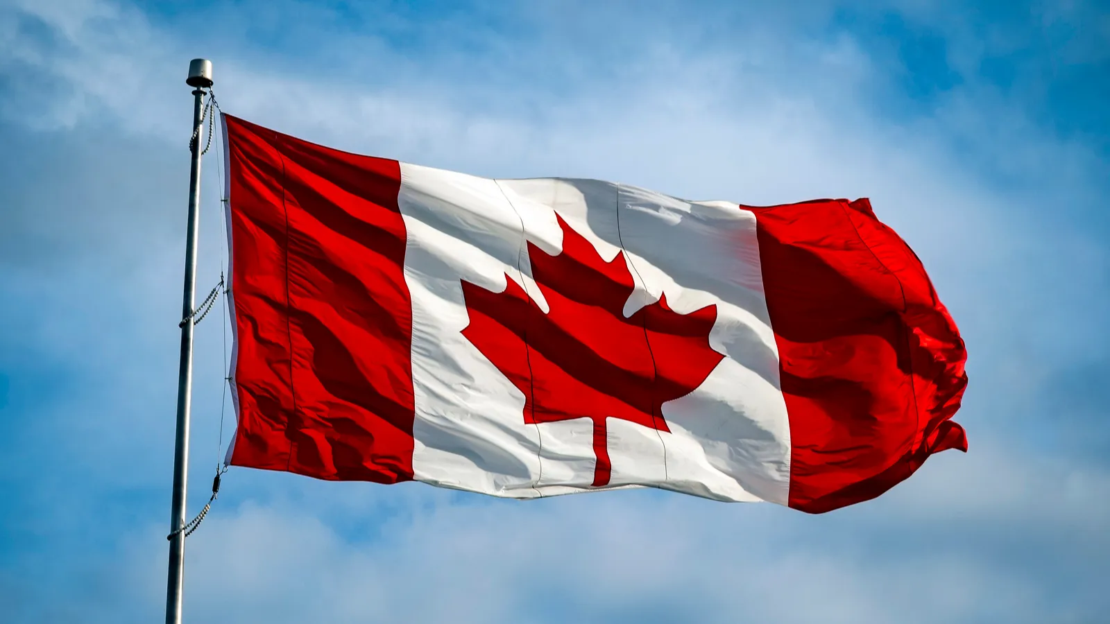 canadian national flag flying in bright sunshine