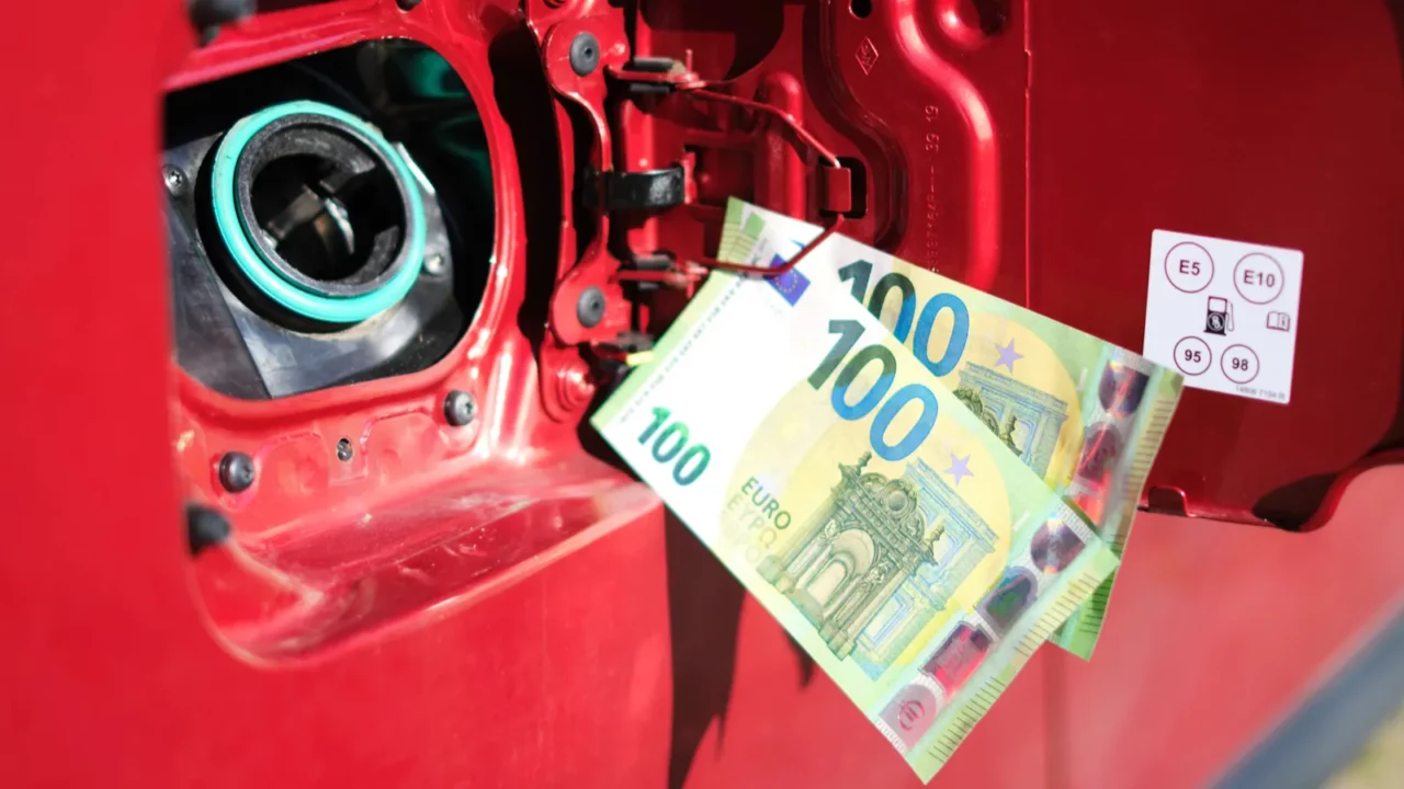 two hundredeuro bills in front of the fuel tank of