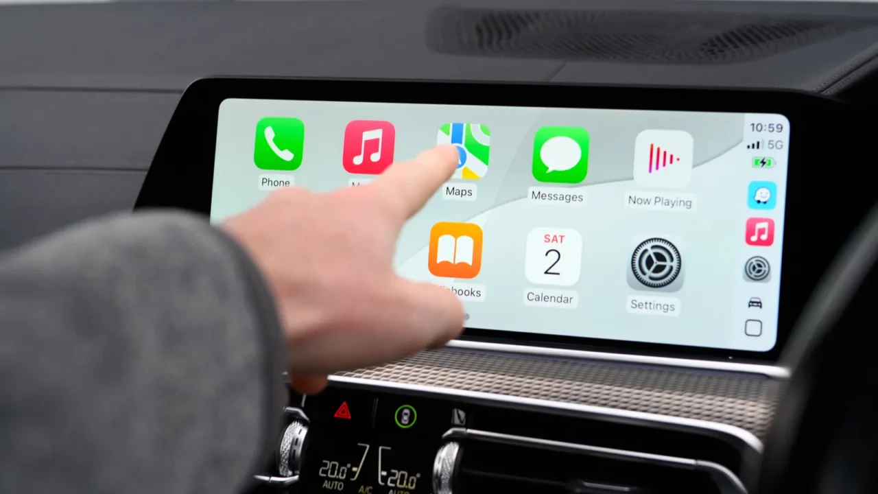 Women touching screen of apple carplay