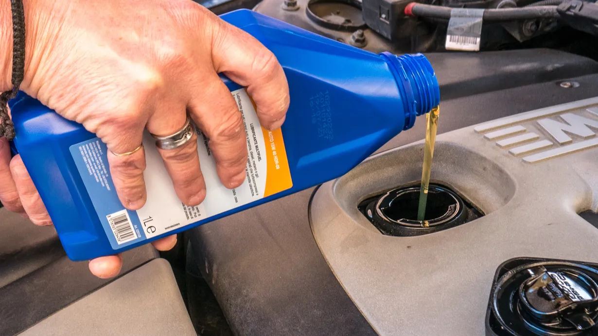 Added bottled engine oil directly into the engine compartment mechanic