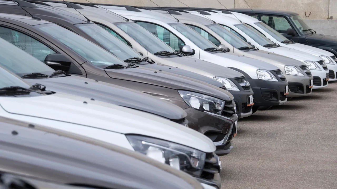 Shot of new cars on a parking in car dealership.