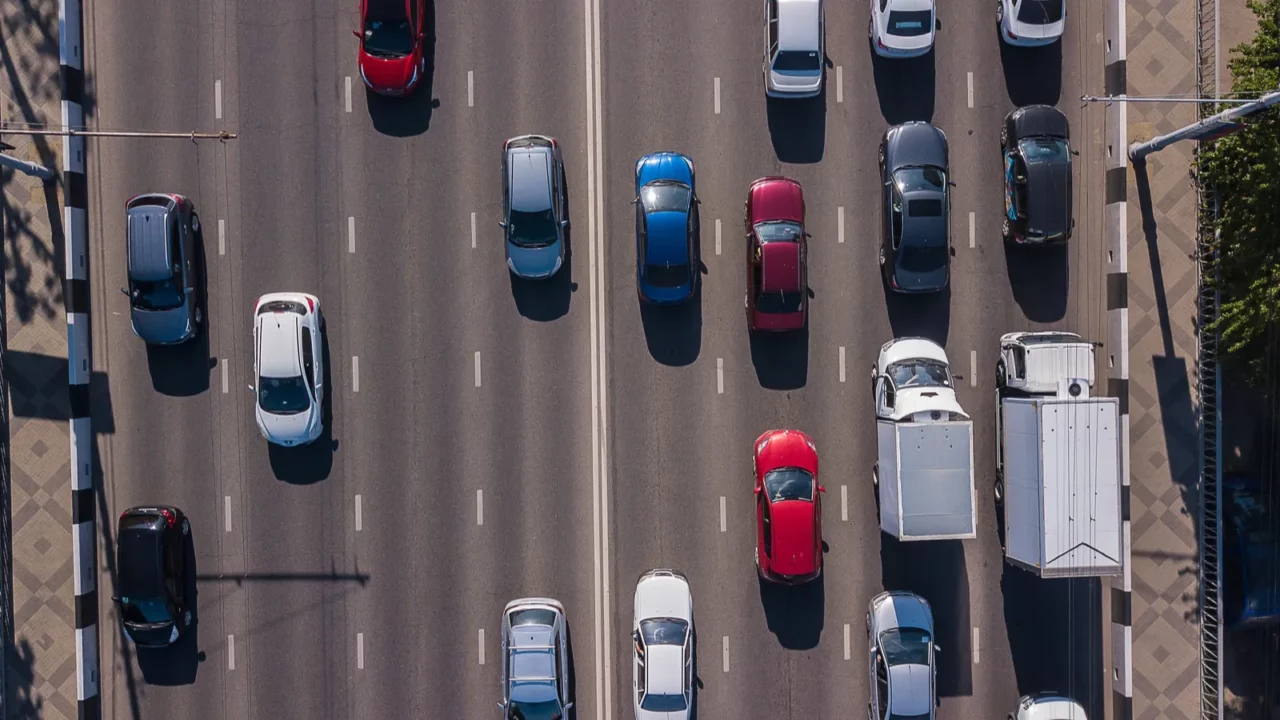 top down aerial view of urban traffic jam rush hour